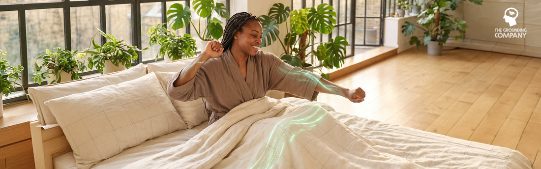 Woman waking refreshed in a sunlit bedroom with energy flowing from a grounding sheet